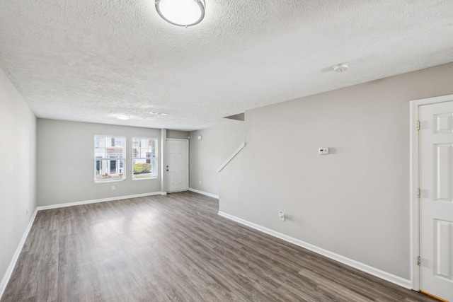 5428 Cedar Ash Xing, Antioch, TN 37013 - unfurnished room featuring a textured ceiling, wood finished floors, and a smoke detector