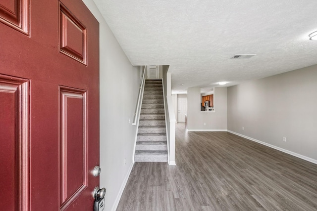 5428 Cedar Ash Xing, Antioch, TN 37013 - entrance foyer with a textured ceiling, wood finished floors, and stairs