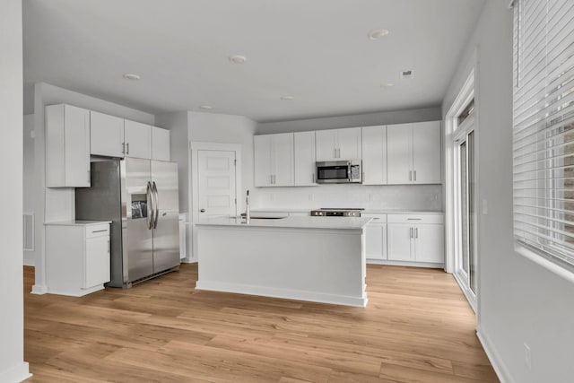510 Hinton St, Lebanon, TN 37090 - kitchen with appliances with stainless steel finishes, light countertops, white cabinets, tasteful backsplash, and recessed lighting