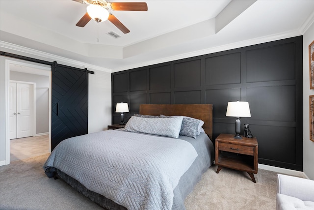 509 Eagleview Dr, Eagleville, TN 37060 - bedroom with light colored carpet, a barn door, a decorative wall, a raised ceiling, and ceiling fan