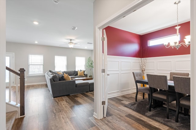 509 Eagleview Dr, Eagleville, TN 37060 - dining room featuring a wainscoted wall, a ceiling fan, a chandelier, dark wood finished floors, and a decorative wall