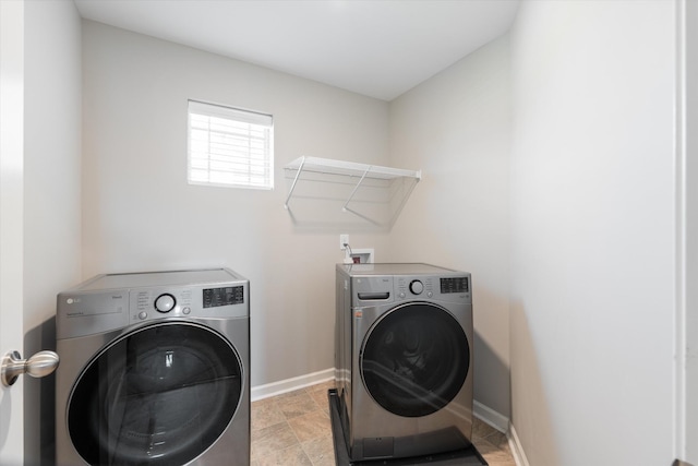 509 Eagleview Dr, Eagleville, TN 37060 - laundry area featuring washer and clothes dryer and light stone finish floors