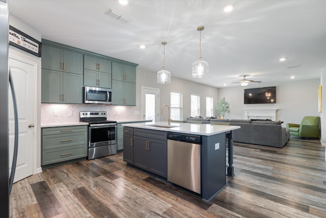 509 Eagleview Dr, Eagleville, TN 37060 - kitchen featuring appliances with stainless steel finishes, light countertops, ceiling fan, recessed lighting, and tasteful backsplash