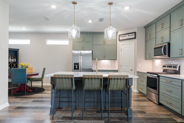 509 Eagleview Dr, Eagleville, TN 37060 - kitchen featuring stainless steel appliances, light countertops, recessed lighting, tasteful backsplash, and green cabinets