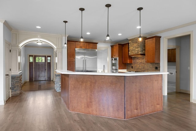 1118 Averwater Run, Murfreesboro, TN 37128 - kitchen with built in fridge, decorative backsplash, light countertops, arched walkways, and crown molding