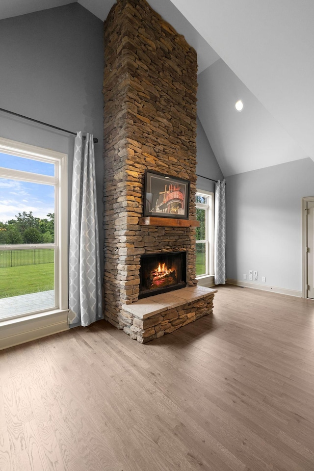 1118 Averwater Run, Murfreesboro, TN 37128 - unfurnished living room with a stone fireplace, wood finished floors, and high vaulted ceiling