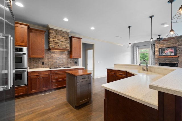 1118 Averwater Run, Murfreesboro, TN 37128 - kitchen with a large island with sink, backsplash, stainless steel appliances, dark wood finished floors, and recessed lighting
