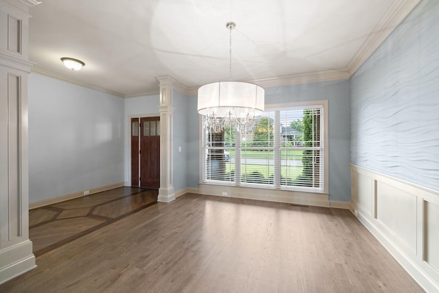 1118 Averwater Run, Murfreesboro, TN 37128 - unfurnished dining area featuring light wood-style flooring, a chandelier, ornamental molding, ornate columns, and a wainscoted wall