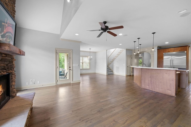 1118 Averwater Run, Murfreesboro, TN 37128 - unfurnished living room with a stone fireplace, dark wood-style flooring, a ceiling fan, stairs, and recessed lighting