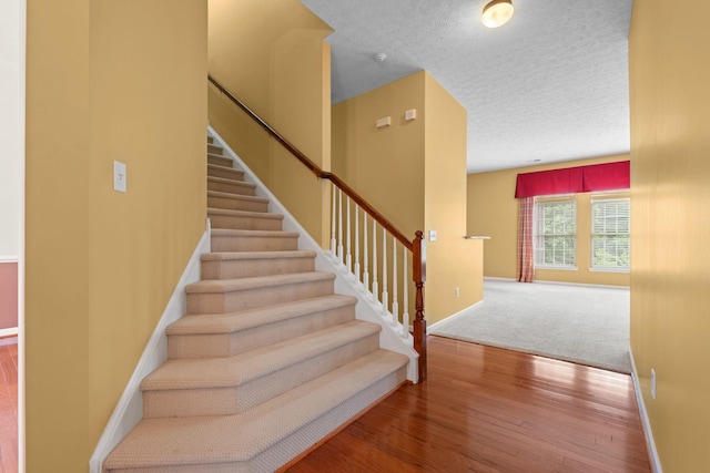 225 Cobblestone Lndg, Mount Juliet, TN 37122 - staircase featuring wood finished floors and a textured ceiling