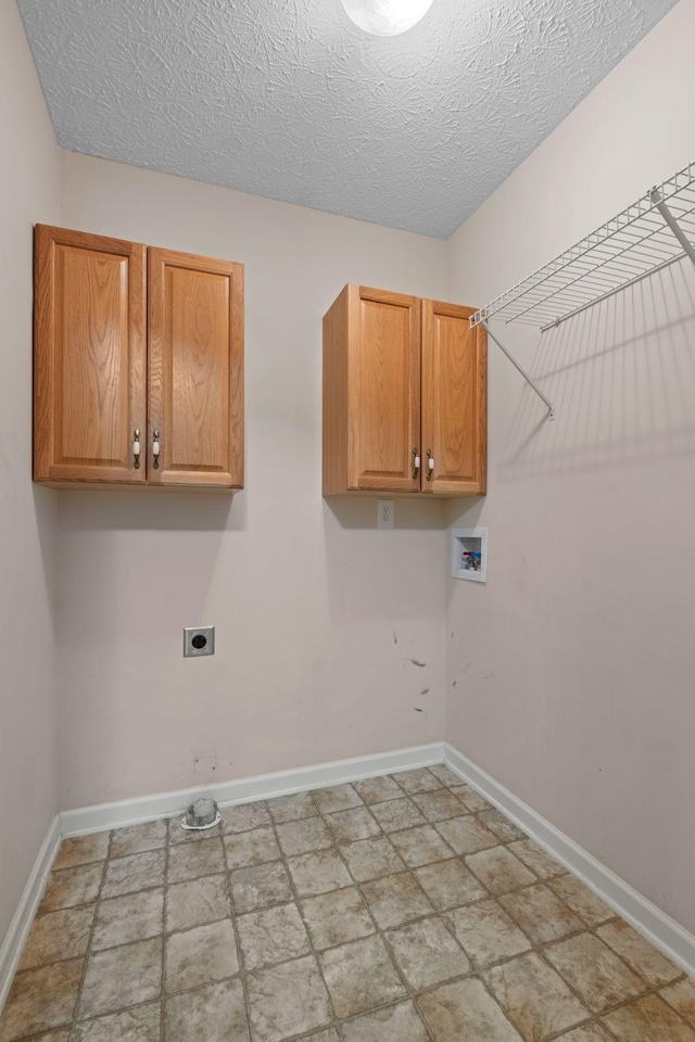 225 Cobblestone Lndg, Mount Juliet, TN 37122 - washroom with washer hookup, hookup for an electric dryer, cabinet space, a textured ceiling, and light stone finish flooring