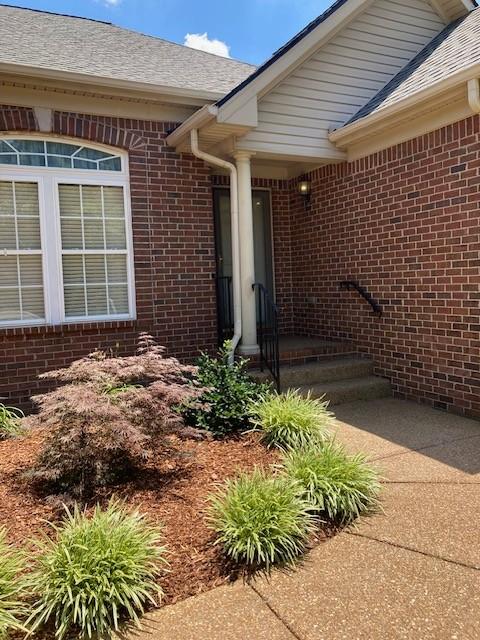 225 Cobblestone Lndg, Mount Juliet, TN 37122 - entrance to property featuring brick siding and roof with shingles