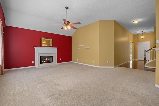 225 Cobblestone Lndg, Mount Juliet, TN 37122 - unfurnished living room with a ceiling fan, carpet flooring, a fireplace with flush hearth, and lofted ceiling