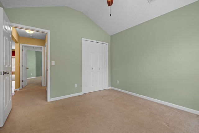 225 Cobblestone Lndg, Mount Juliet, TN 37122 - unfurnished bedroom featuring vaulted ceiling, light carpet, a closet, a ceiling fan, and a textured ceiling