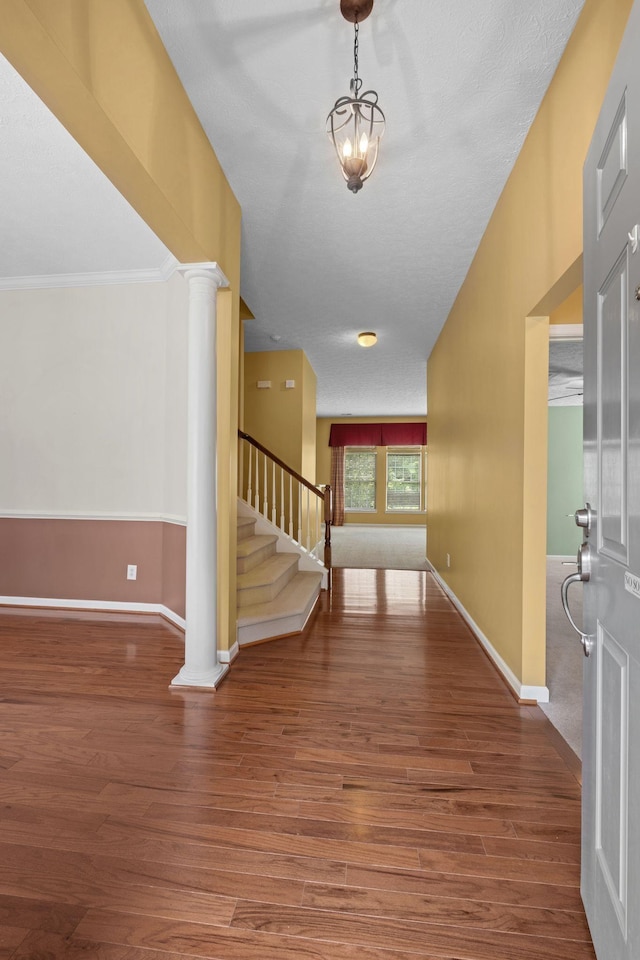 225 Cobblestone Lndg, Mount Juliet, TN 37122 - entryway featuring stairway, wood finished floors, ornate columns, ornamental molding, and a chandelier