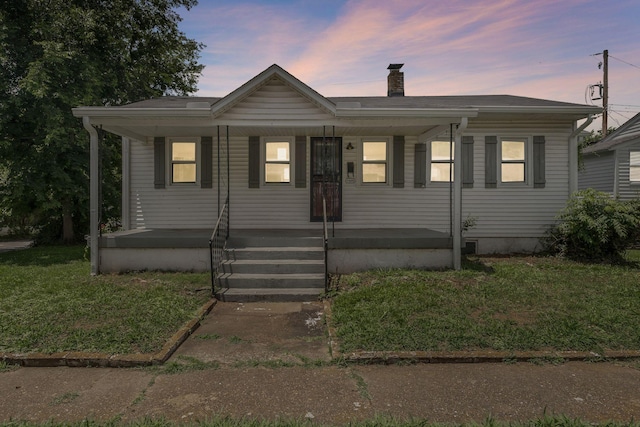 1410 Debow St, Old Hickory, TN 37138 - view of front of house featuring a chimney, covered porch, and a yard