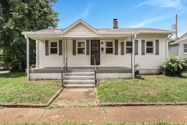 1410 Debow St, Old Hickory, TN 37138 - view of front of property featuring a chimney, a front yard, and covered porch
