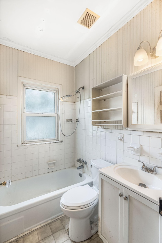 1410 Debow St, Old Hickory, TN 37138 - bathroom featuring vanity, bathtub / shower combination, crown molding, and tile walls