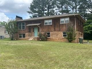1708 Deer Hollow Dr, Lawrenceburg, TN 38464 - split foyer home with a chimney and a front yard