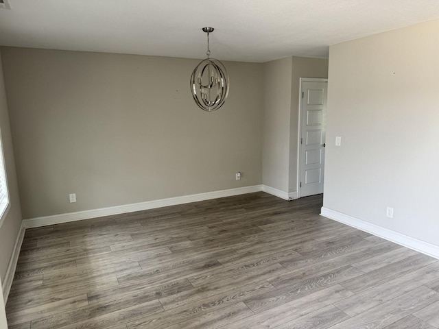 1175 Ewing Way, Clarksville, TN 37043 - unfurnished room with a chandelier and wood finished floors