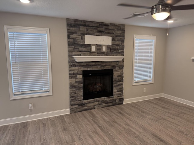 1175 Ewing Way, Clarksville, TN 37043 - unfurnished living room featuring ceiling fan, wood finished floors, and a fireplace