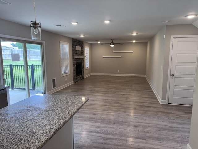 1175 Ewing Way, Clarksville, TN 37043 - unfurnished living room featuring ceiling fan, dark wood finished floors, a fireplace, and recessed lighting