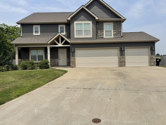1175 Ewing Way, Clarksville, TN 37043 - view of front of property with driveway, a front yard, board and batten siding, and an attached garage
