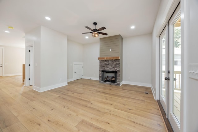 403 Boren St, Springfield, TN 37172 - unfurnished living room with light wood finished floors, ceiling fan, a stone fireplace, and recessed lighting