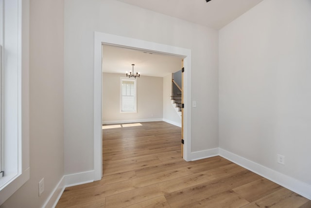403 Boren St, Springfield, TN 37172 - empty room with stairs, a chandelier, and light wood finished floors