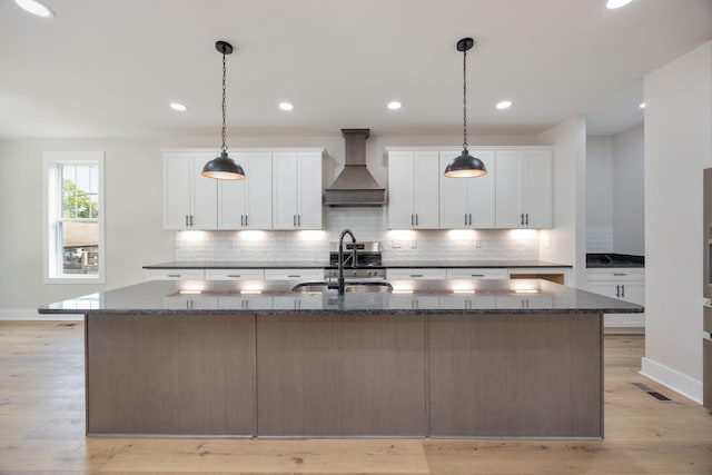 403 Boren St, Springfield, TN 37172 - kitchen with custom exhaust hood, tasteful backsplash, a spacious island, white cabinets, and recessed lighting