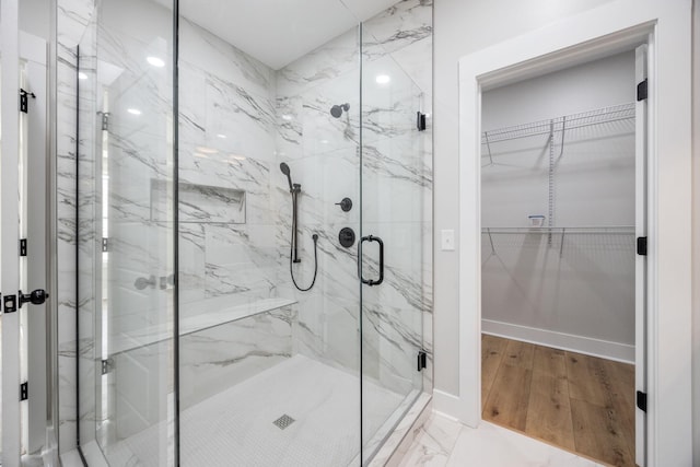 403 Boren St, Springfield, TN 37172 - full bathroom with a marble finish shower, a walk in closet, and wood finished floors