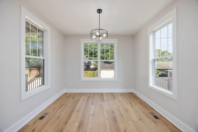 403 Boren St, Springfield, TN 37172 - unfurnished dining area with healthy amount of natural light, light wood-type flooring, and a chandelier