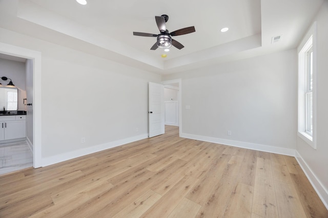 403 Boren St, Springfield, TN 37172 - spare room featuring a raised ceiling, light wood-style floors, a ceiling fan, and recessed lighting