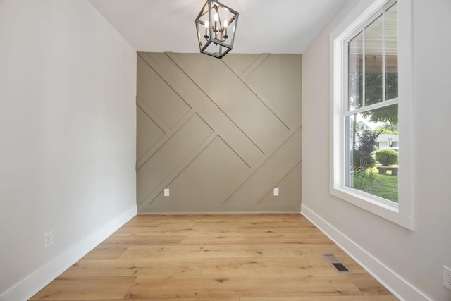 403 Boren St, Springfield, TN 37172 - unfurnished dining area with a decorative wall, a chandelier, and light wood finished floors
