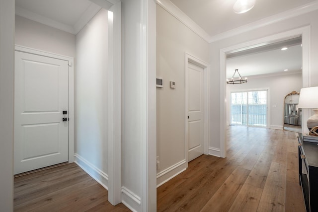 1015 Amelia Ct, Chattanooga, TN 37412 - hallway featuring ornamental molding, light wood finished floors, and a chandelier