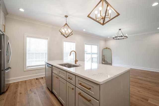1015 Amelia Ct, Chattanooga, TN 37412 - kitchen with a chandelier, appliances with stainless steel finishes, light wood-style flooring, ornamental molding, and a kitchen island with sink