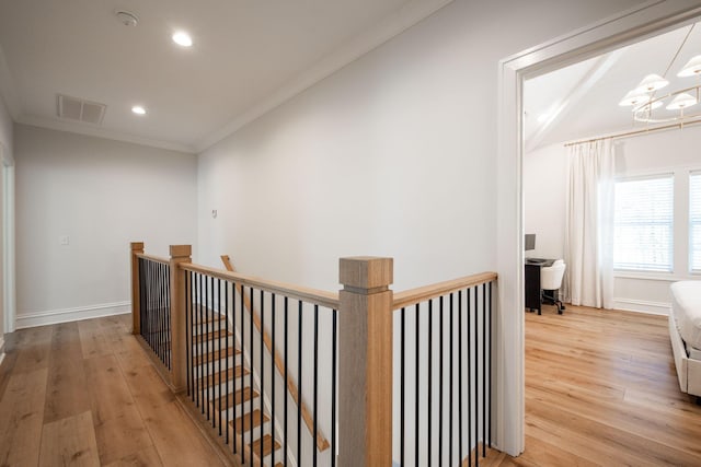 1015 Amelia Ct, Chattanooga, TN 37412 - corridor featuring an upstairs landing, light wood-style floors, a chandelier, recessed lighting, and crown molding
