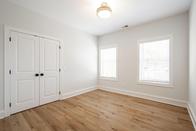 1015 Amelia Ct, Chattanooga, TN 37412 - unfurnished bedroom with light wood-style flooring and a closet