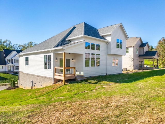 8668 Woodbury Acre Ct, Harrison, TN 37341 - rear view of property featuring a wooden deck, a yard, and roof with shingles