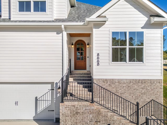 8668 Woodbury Acre Ct, Harrison, TN 37341 - doorway to property with roof with shingles