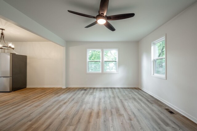 35 Agnes Ave, Chattanooga, TN 37406 - spare room with wood finished floors, ceiling fan, and a chandelier