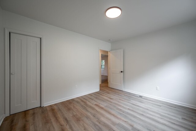 35 Agnes Ave, Chattanooga, TN 37406 - unfurnished bedroom with wood finished floors and a closet