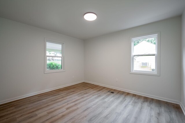 35 Agnes Ave, Chattanooga, TN 37406 - unfurnished room with healthy amount of natural light and wood finished floors