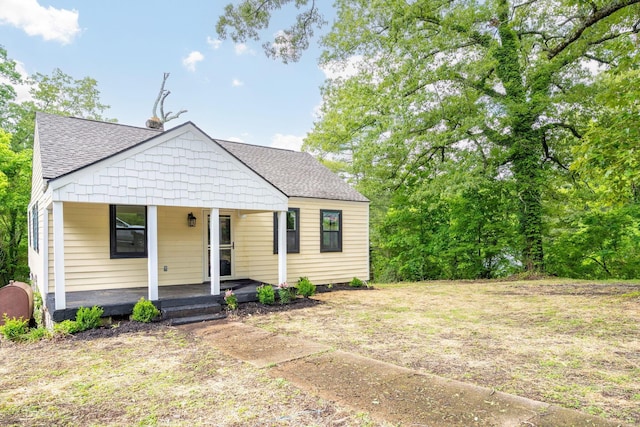 35 Agnes Ave, Chattanooga, TN 37406 - bungalow with a porch, a shingled roof, and a chimney