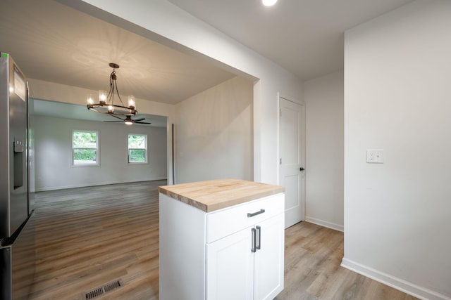 35 Agnes Ave, Chattanooga, TN 37406 - kitchen featuring wood counters, a chandelier, light wood-style flooring, white cabinetry, and open floor plan