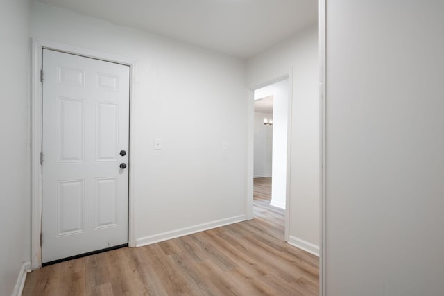 35 Agnes Ave, Chattanooga, TN 37406 - corridor with light wood-type flooring and a chandelier