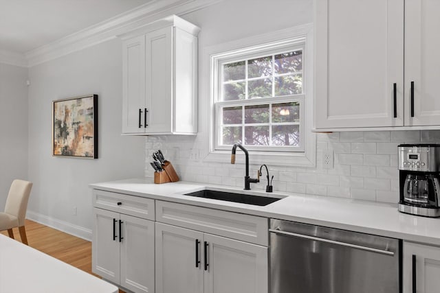 715 Forest Ave, Chattanooga, TN 37405 - kitchen with dishwasher, crown molding, decorative backsplash, light countertops, and white cabinets