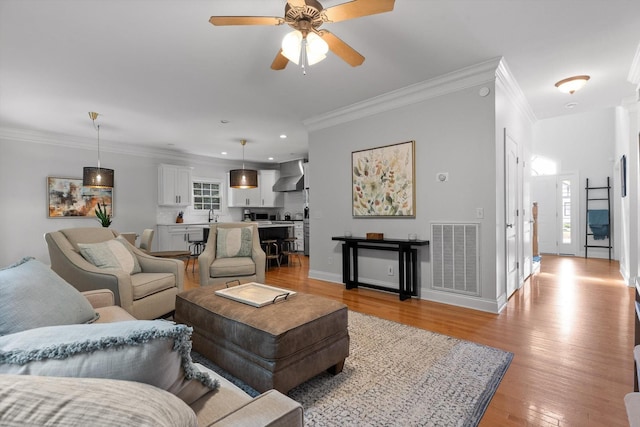 715 Forest Ave, Chattanooga, TN 37405 - living area with crown molding, light wood-style floors, ceiling fan, and recessed lighting