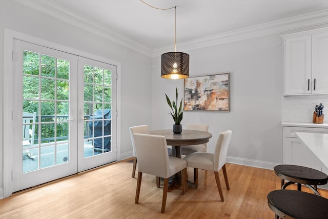 715 Forest Ave, Chattanooga, TN 37405 - dining space featuring crown molding and light wood-style flooring