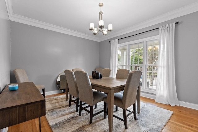 715 Forest Ave, Chattanooga, TN 37405 - dining space featuring a chandelier, ornamental molding, and light wood-style floors